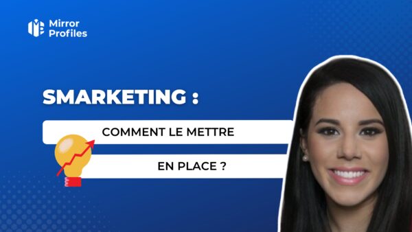 A blue background image with text "SMARKETING: COMMENT LE METTRE EN PLACE?" and a smiling woman on the right. An icon of a lightbulb with a rising arrow is next to the text, emphasizing implementing Smarketing. "Mirror Profiles" logo is in the top left.